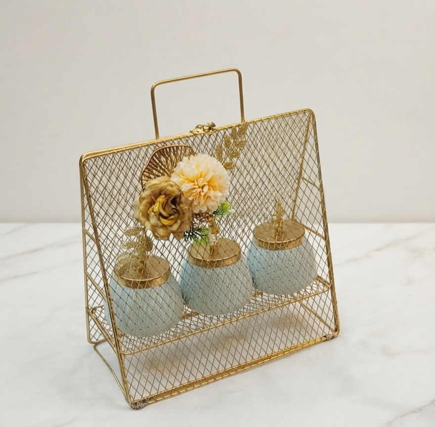 Tall, triangular gold-finished metal wire mesh display basket